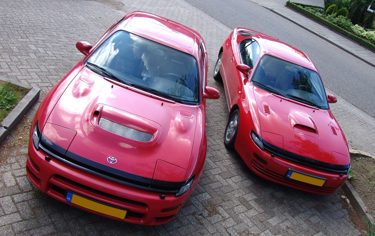 two red toyota sports cars side by side