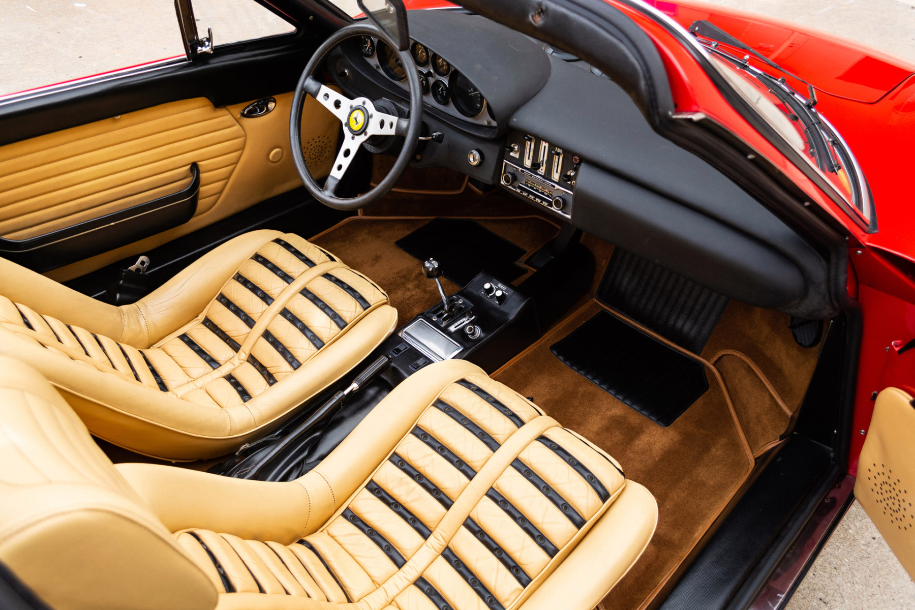 interior picture of tan and black seats and dashboard