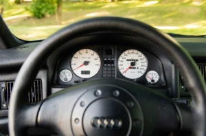 Steering wheel and instrument gauges close up